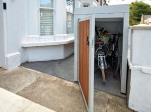 Bike bay — two adult bikes, door open
